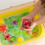 Kostki sensoryczne świecące w wodzie Elmo Ulica Sezamkowa - zabawka kąpielowa / Glo Pals