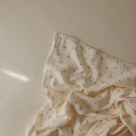 Otulacz z organicznej bawełny - Bows / Mushie