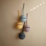 mushie-etui-na-smoczek-do-wozka-kula-ball-pale-daffodil (2).jpg